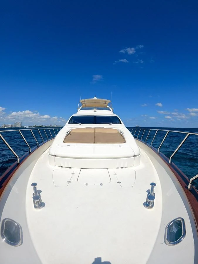 a white yacht on a dock aboard AZURE Yacht for Sale