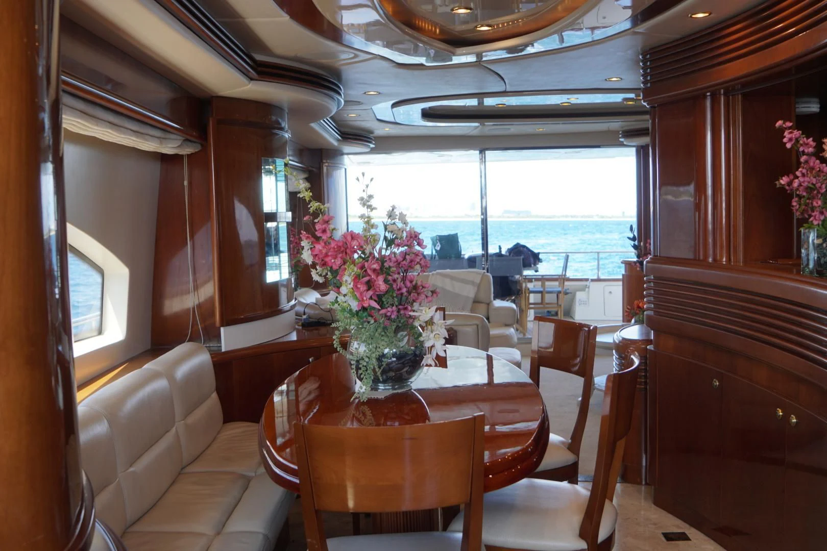 a dining room with a table and chairs aboard AZURE Yacht for Sale