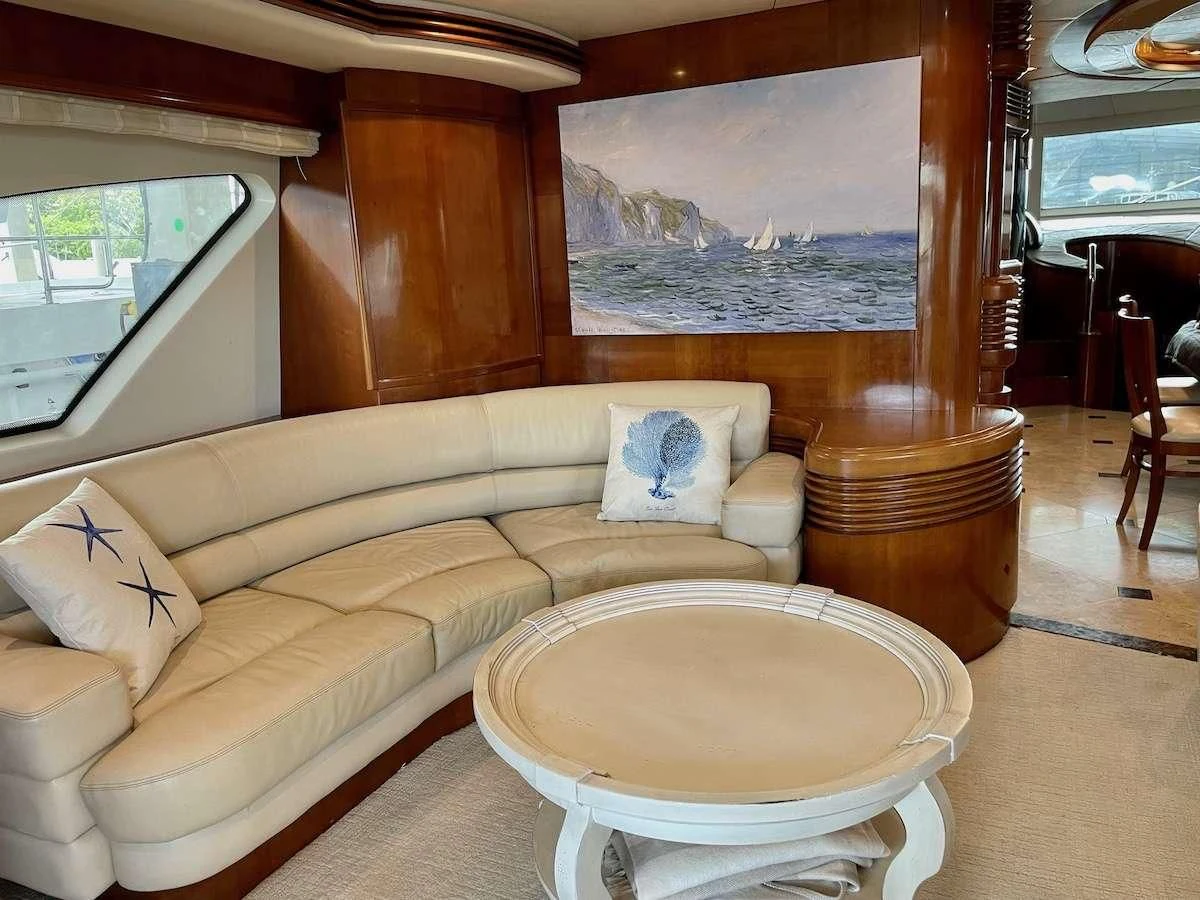 a living room with a couch and a table aboard AZURE Yacht for Sale