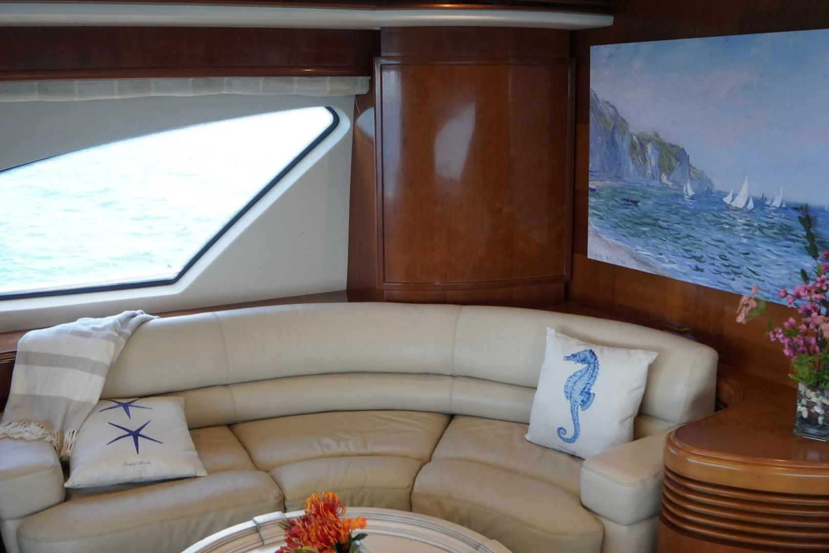 a couch with pillows and a table aboard AZURE Yacht for Sale