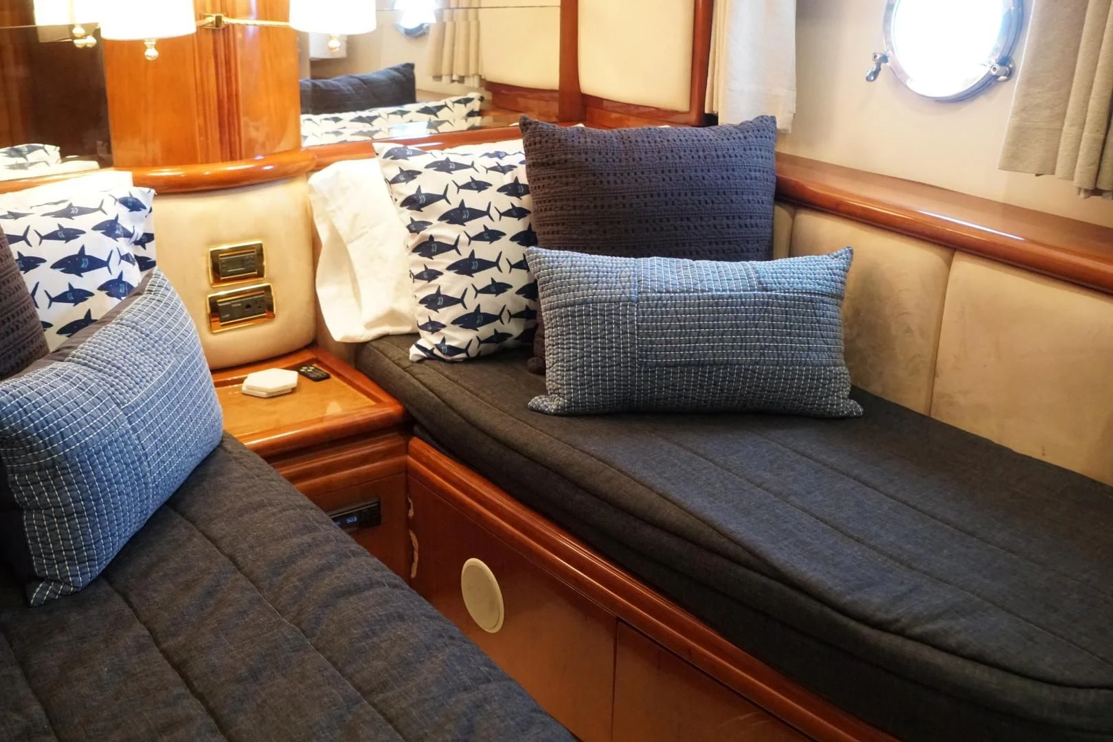 a bed with blue and white pillows aboard AZURE Yacht for Sale