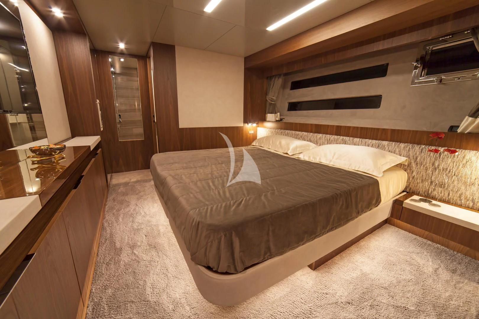 a bedroom with a bed and a desk aboard SEATALY Yacht for Sale