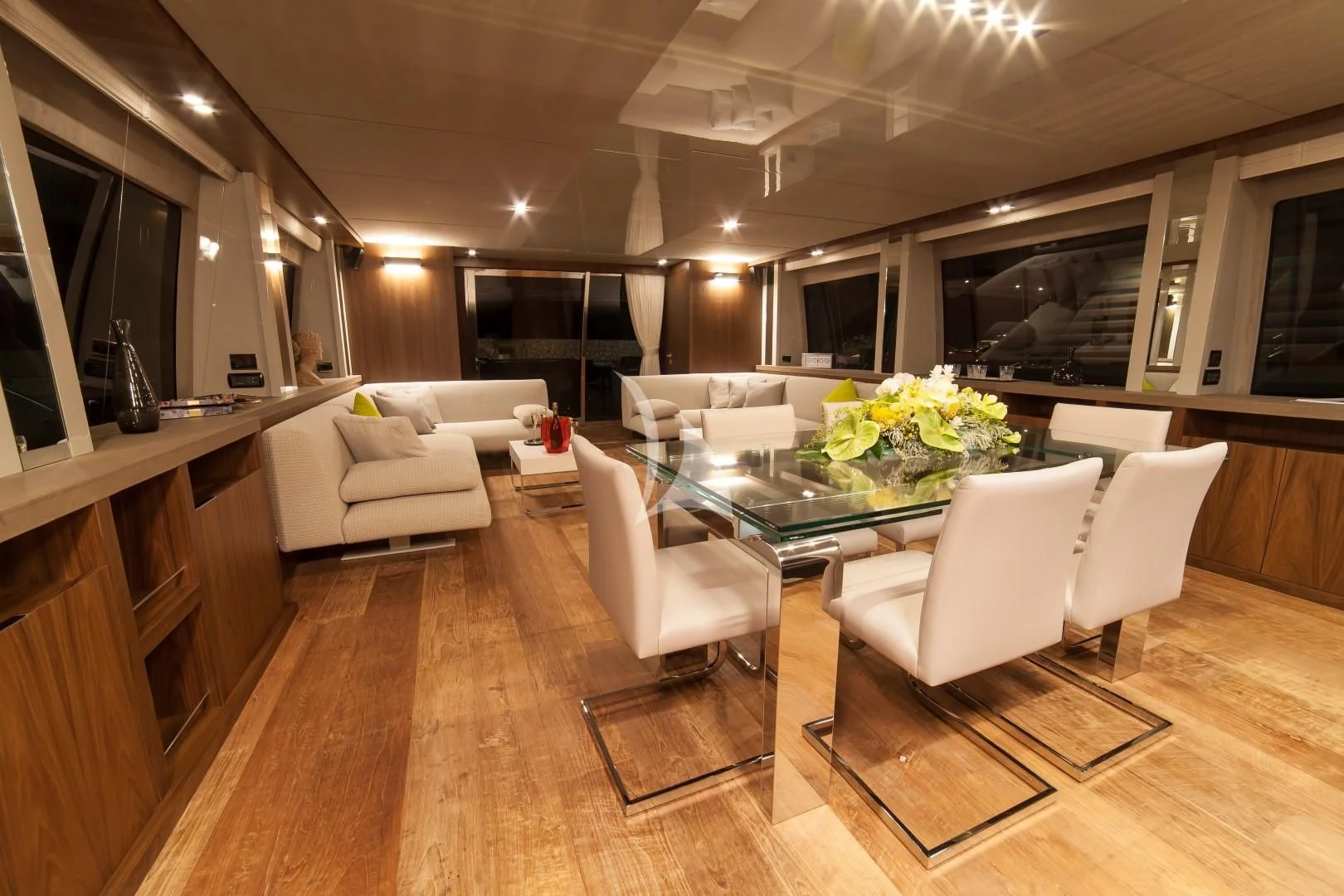 a living room with a table and chairs aboard SEATALY Yacht for Sale