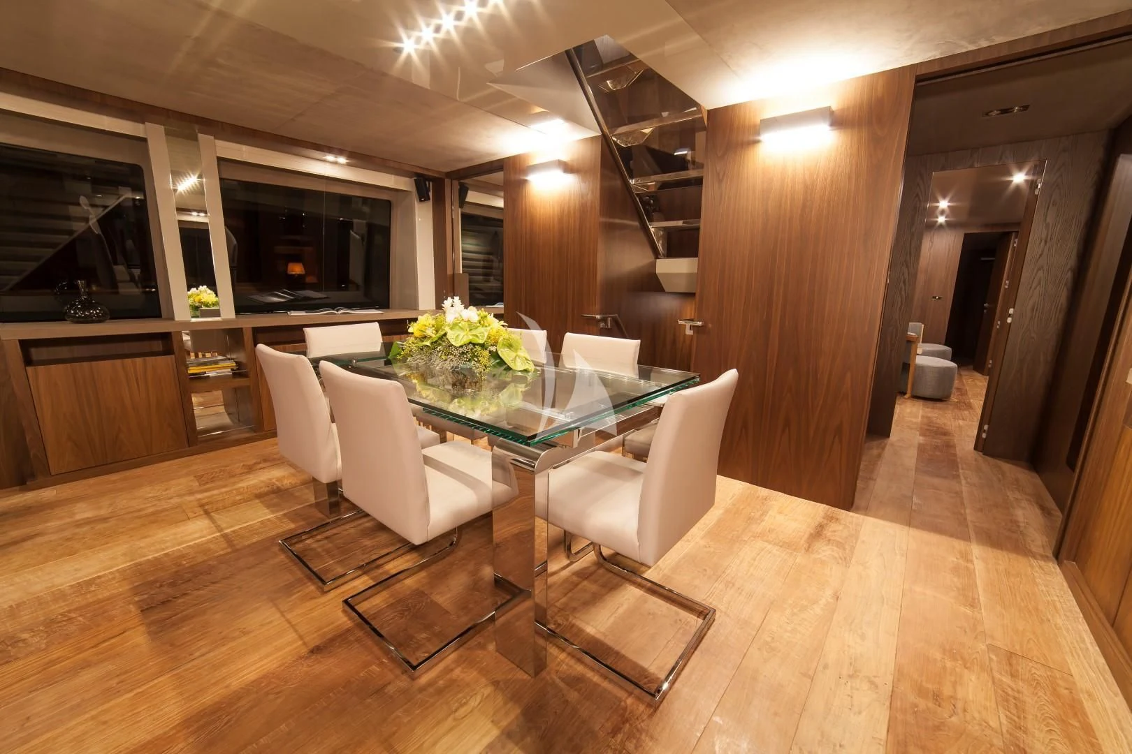 a room with a table chairs and a staircase aboard SEATALY Yacht for Sale