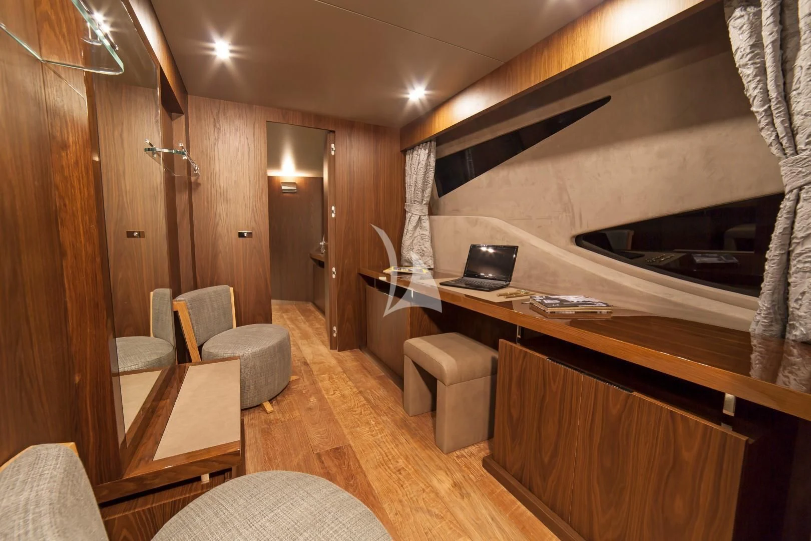 a room with a desk and chairs aboard SEATALY Yacht for Sale