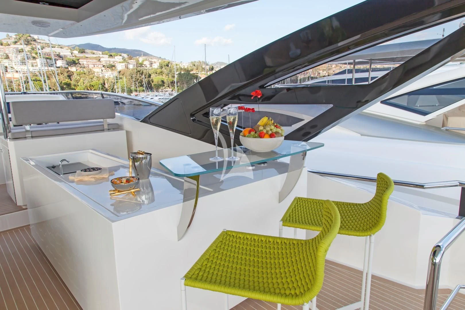 a table with a glass and a bowl of fruit on it aboard SEATALY Yacht for Sale