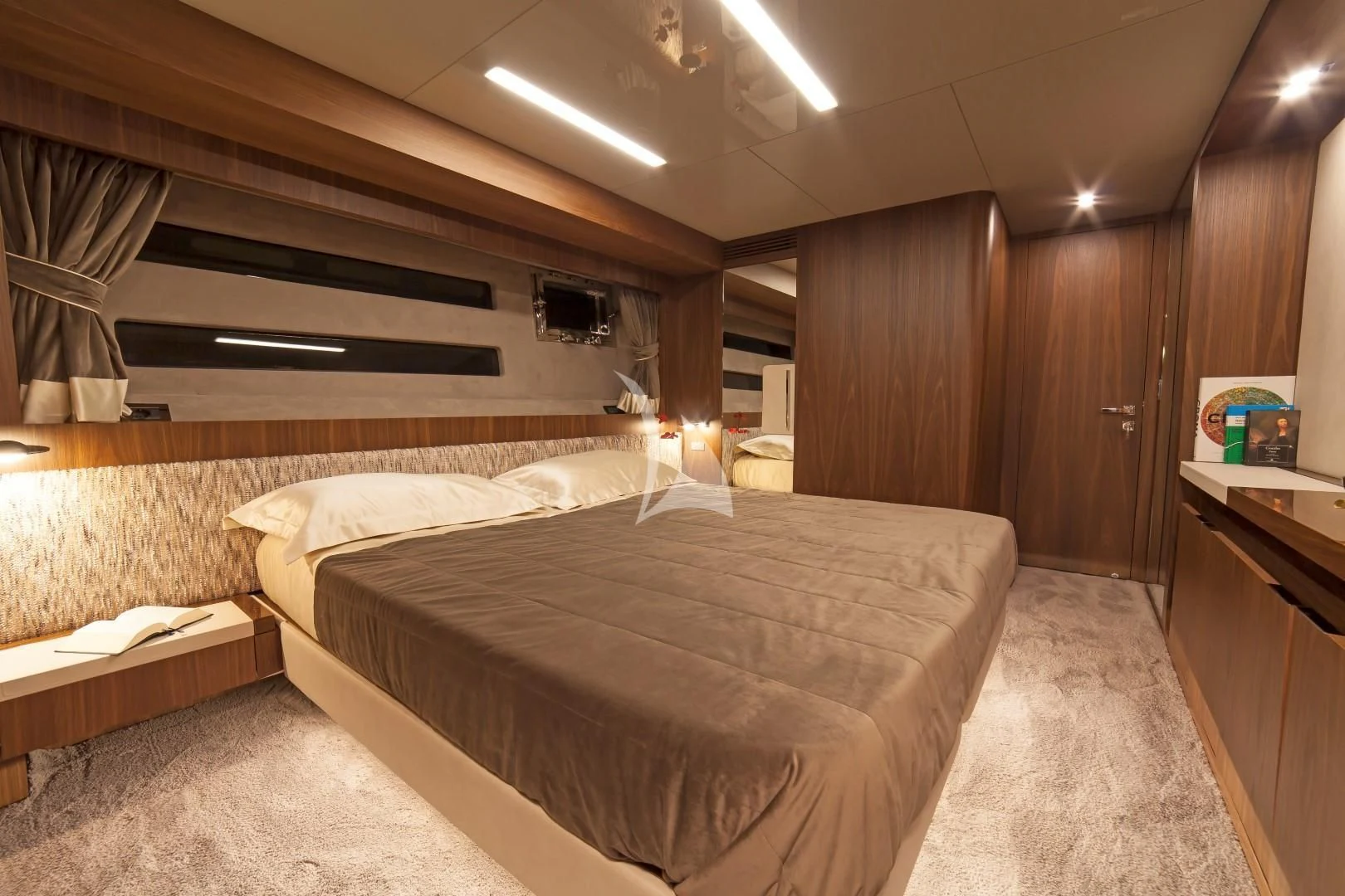 a room with a bed and a desk aboard SEATALY Yacht for Sale