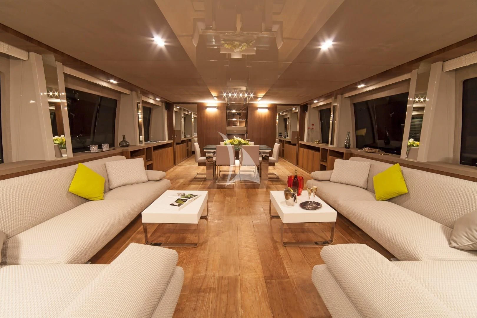a living room with white couches and a wood floor aboard SEATALY Yacht for Sale