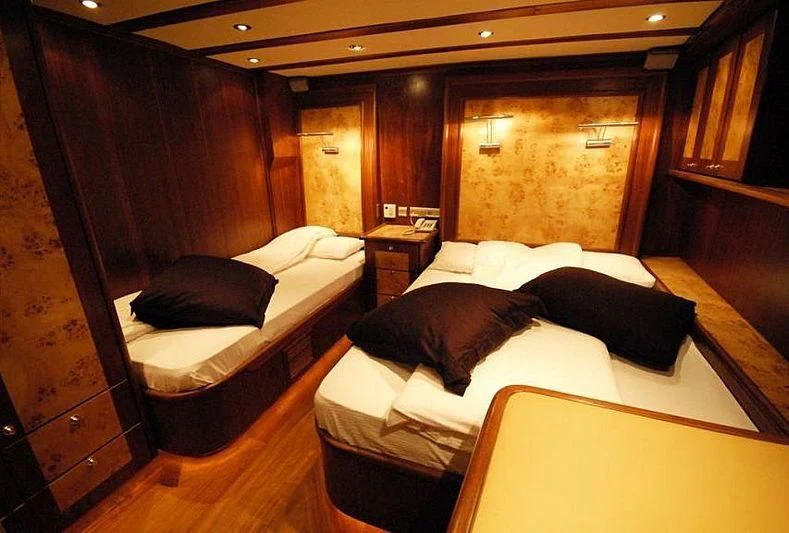 a room with a bed and a couch aboard PHELAN GOOD Yacht for Sale