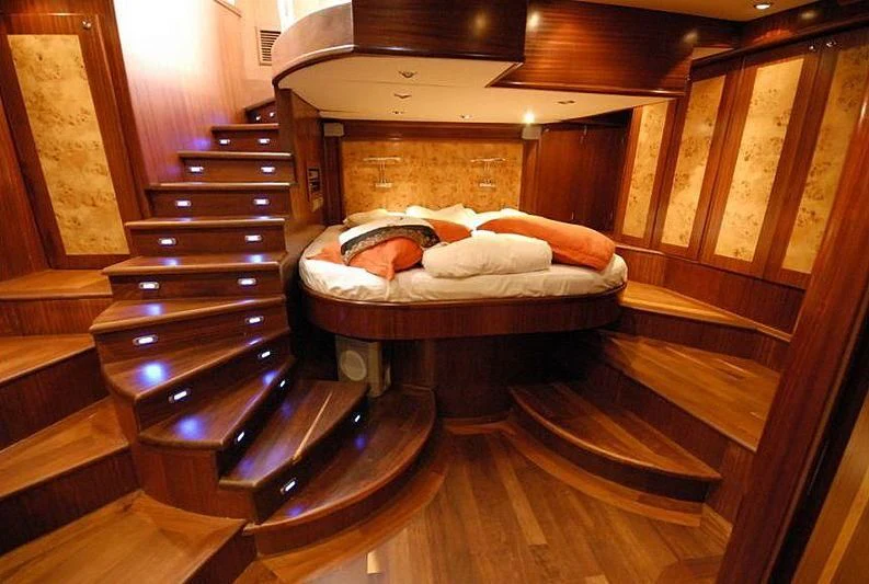 a bed in a wooden room aboard PHELAN GOOD Yacht for Sale