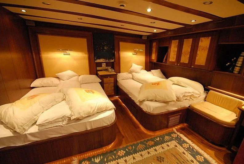 a room with a bed and a mirror aboard PHELAN GOOD Yacht for Sale