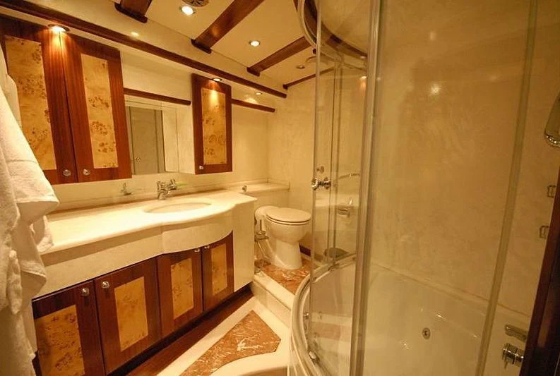 a bathroom with a glass shower aboard PHELAN GOOD Yacht for Sale