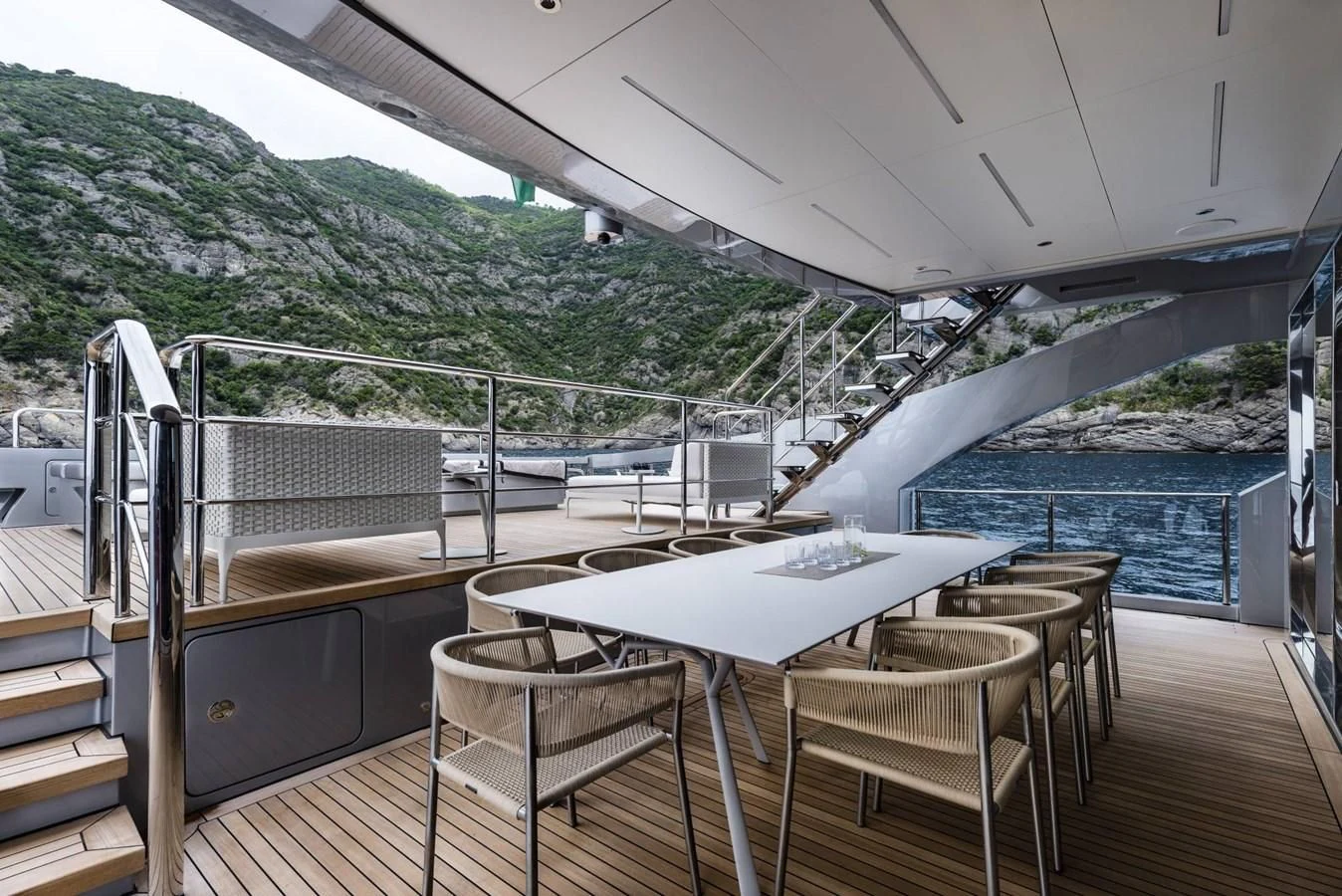 a table and chairs on a deck aboard TOUCH ME Yacht for Sale
