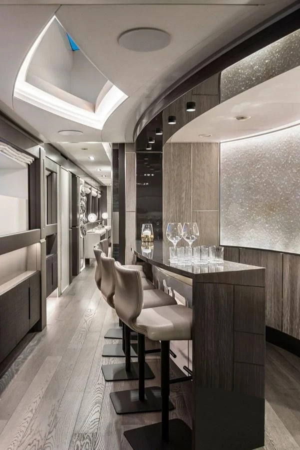 a room with a table and chairs aboard TOUCH ME Yacht for Sale