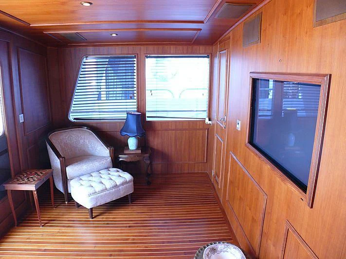a living room with a tv aboard C SIDE Yacht for Sale