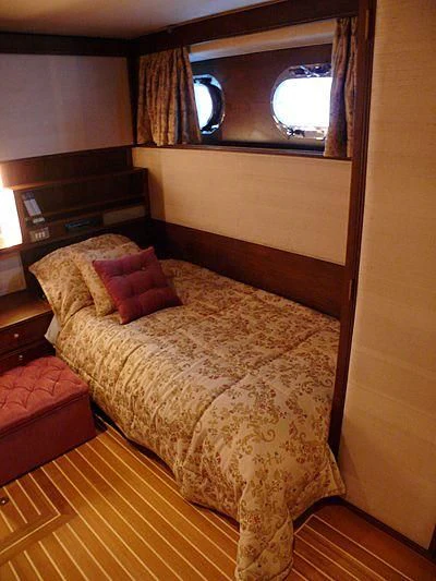a bed in a room aboard C SIDE Yacht for Sale