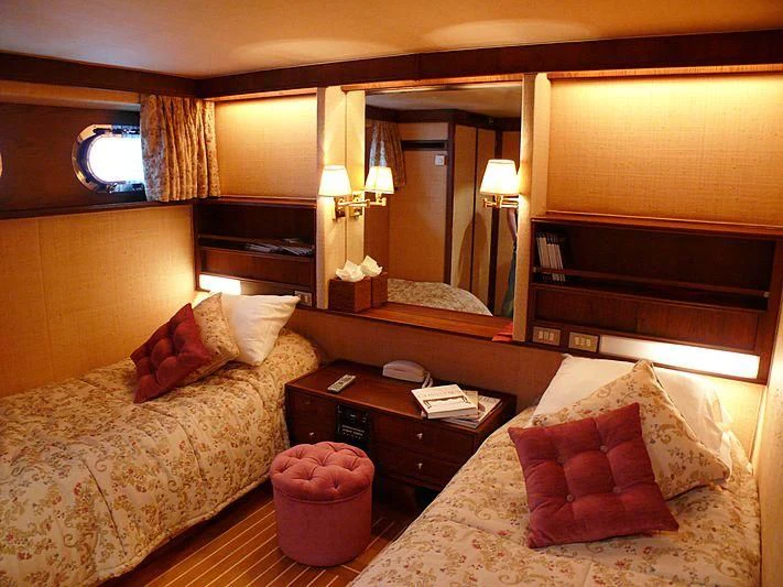 a hotel room with two beds aboard C SIDE Yacht for Sale