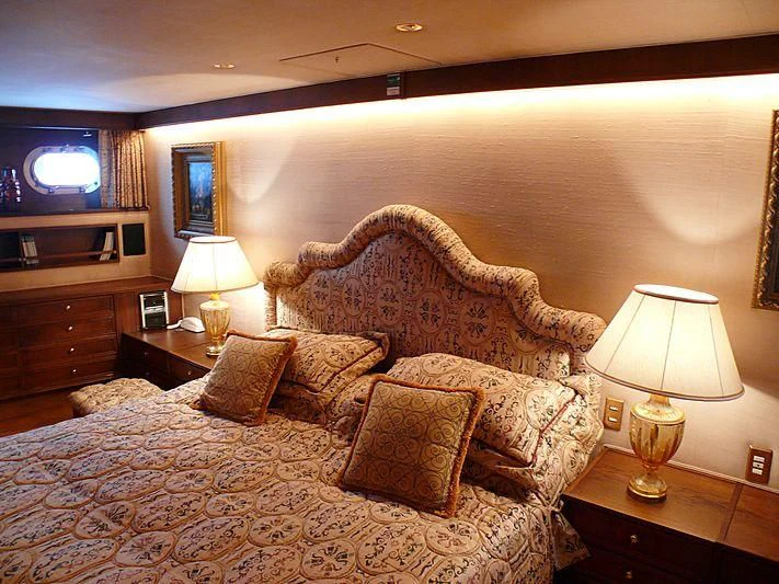 a living room with a couch and a television aboard C SIDE Yacht for Sale