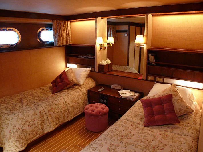 a hotel room with two beds aboard C SIDE Yacht for Sale