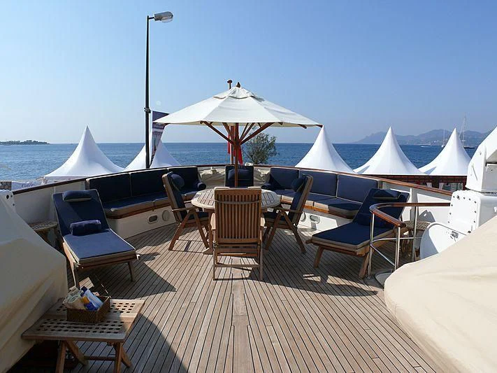 a deck with chairs and umbrellas aboard C SIDE Yacht for Sale