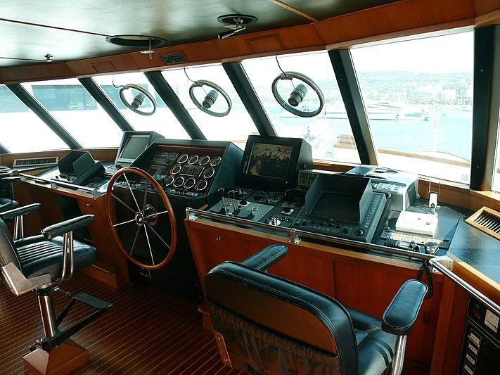 a room with a table and chairs aboard C SIDE Yacht for Sale