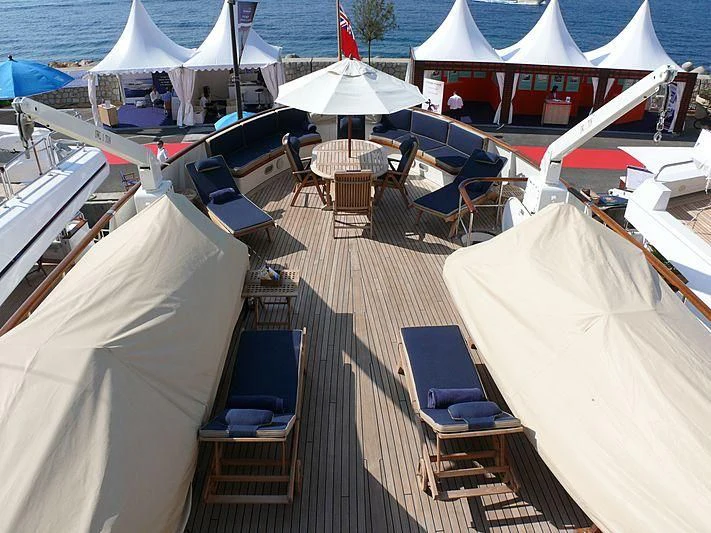 a deck with chairs and umbrellas aboard C SIDE Yacht for Sale