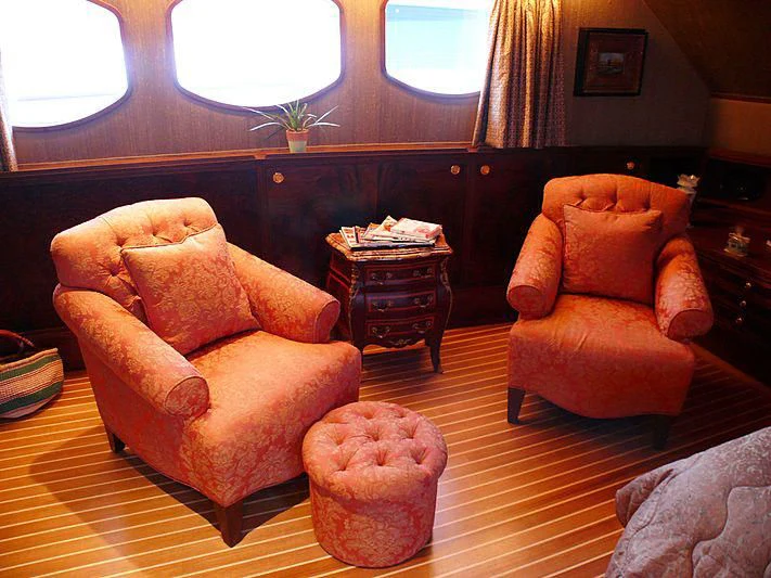 a living room with a couch and a coffee table aboard C SIDE Yacht for Sale