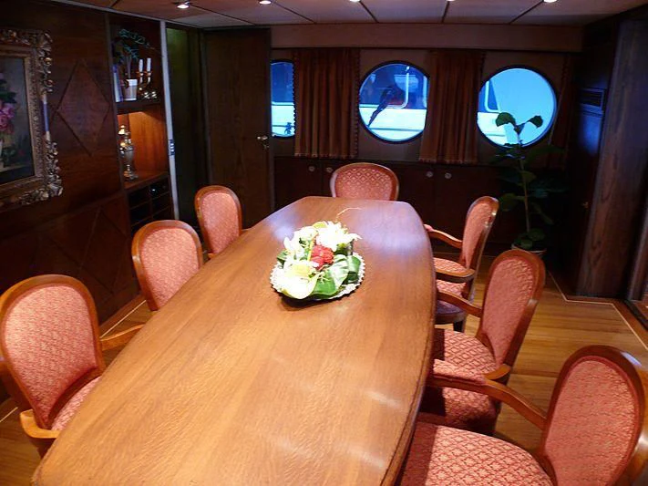 a table with a plate of food aboard C SIDE Yacht for Sale