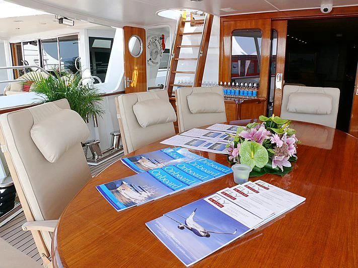 a table with a flower pot on it aboard C SIDE Yacht for Sale