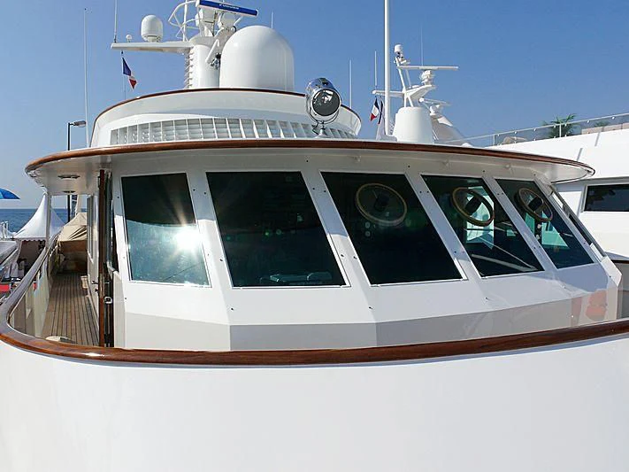 a white boat with a white sail aboard C SIDE Yacht for Sale