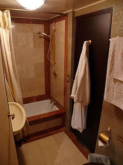 a bathroom with a bathtub and shower aboard C SIDE Yacht for Sale