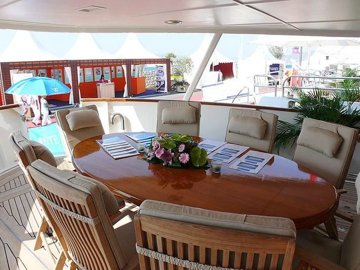 a table with chairs and tables aboard C SIDE Yacht for Sale