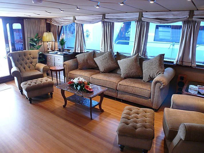 a living room with a couch and a coffee table aboard C SIDE Yacht for Sale