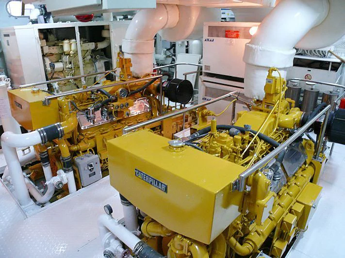 a factory machine with a large piece of equipment in it aboard C SIDE Yacht for Sale