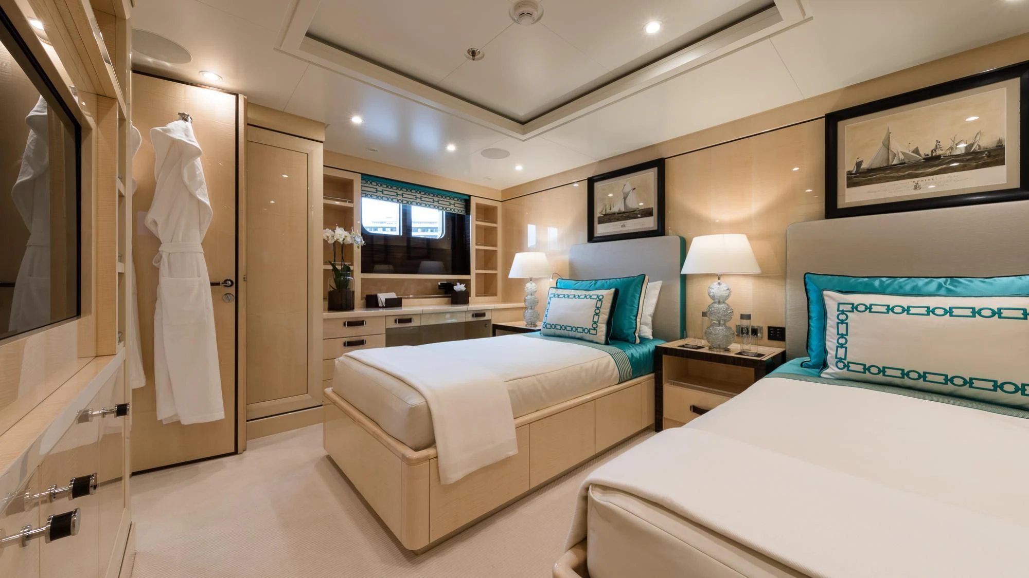 a bedroom with a bed and a mirror aboard AMIGOS Yacht for Charter