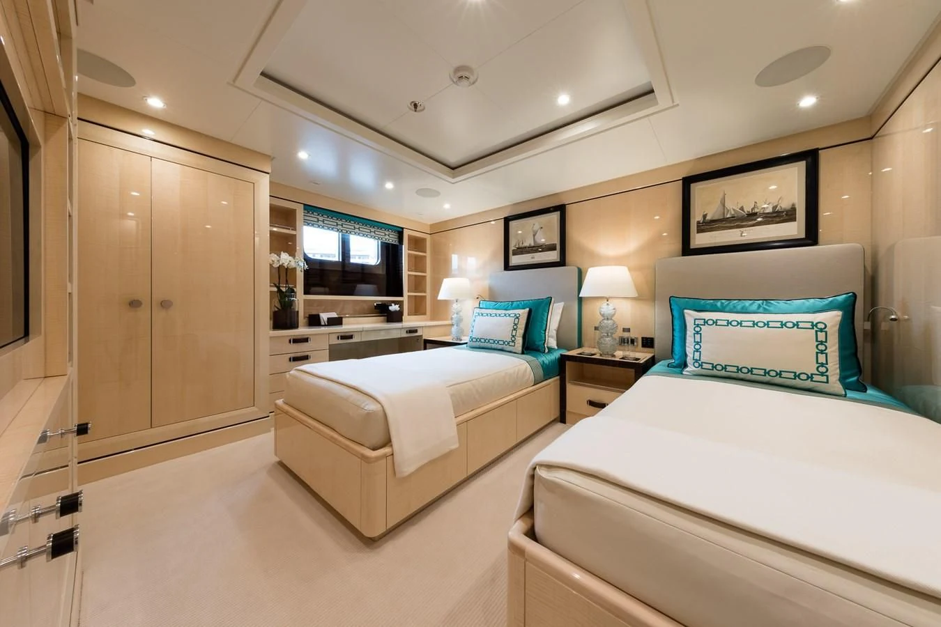 a hotel room with two beds aboard AMIGOS Yacht for Charter