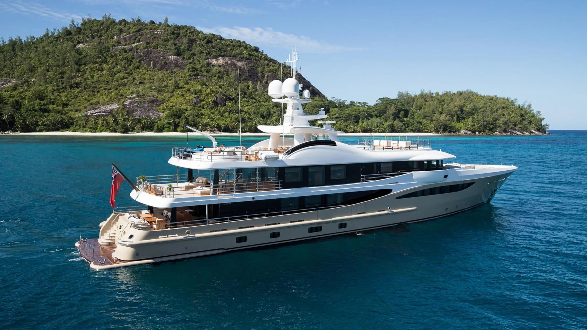 a large white boat in the water aboard AMIGOS Yacht for Charter