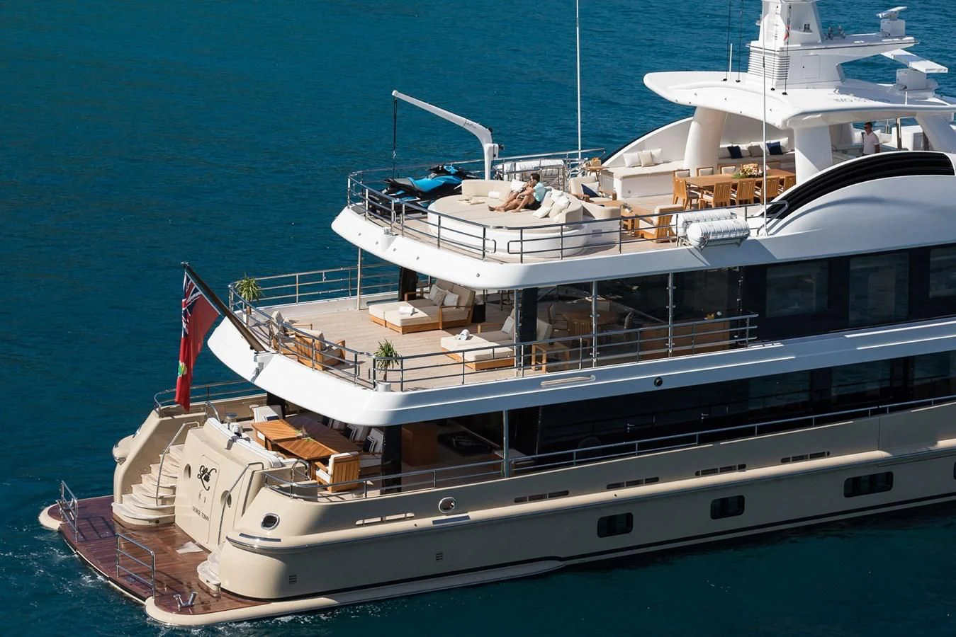 a large boat with a flag on it aboard AMIGOS Yacht for Charter