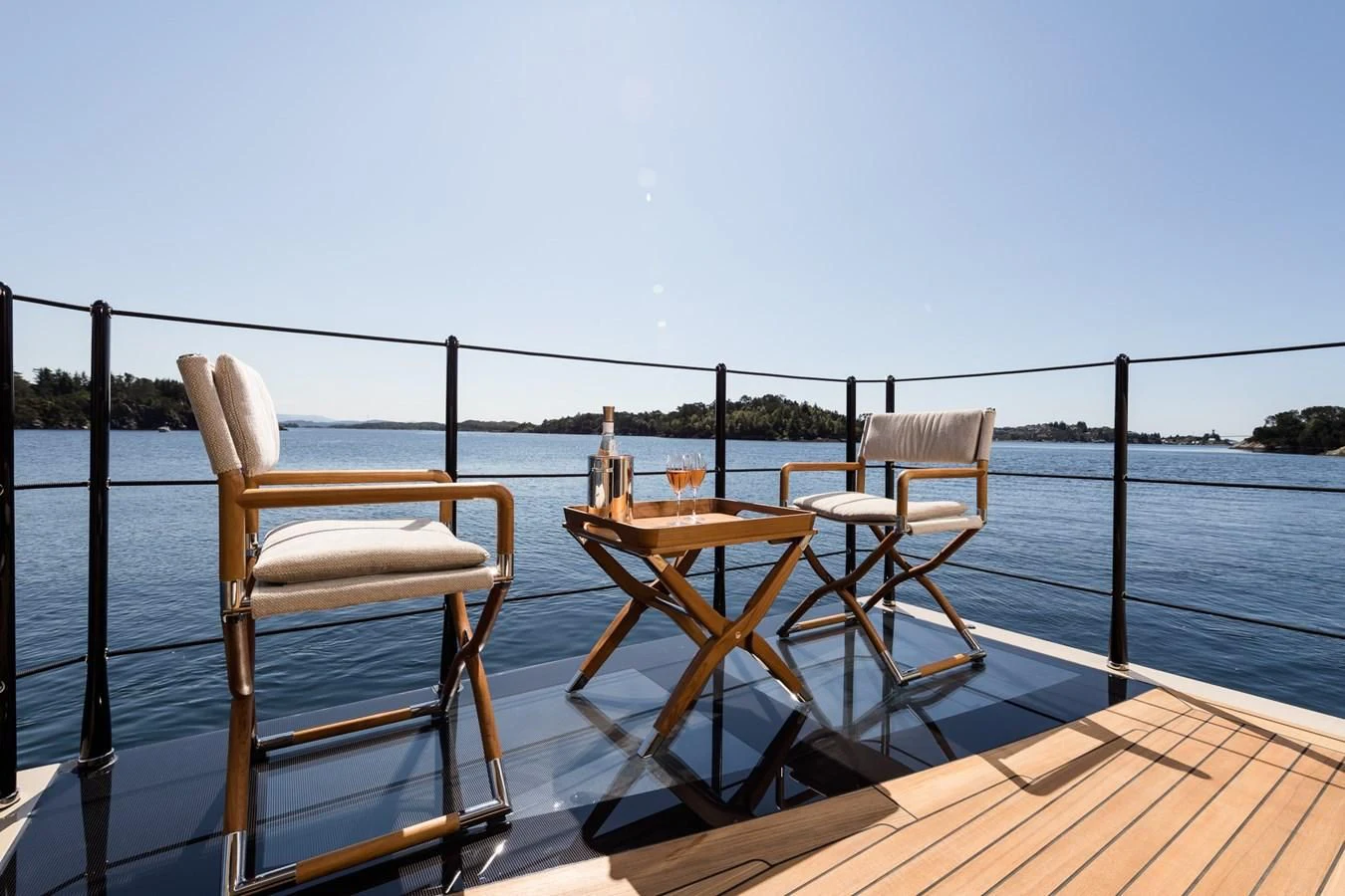 a table and chairs on a deck aboard AMIGOS Yacht for Charter