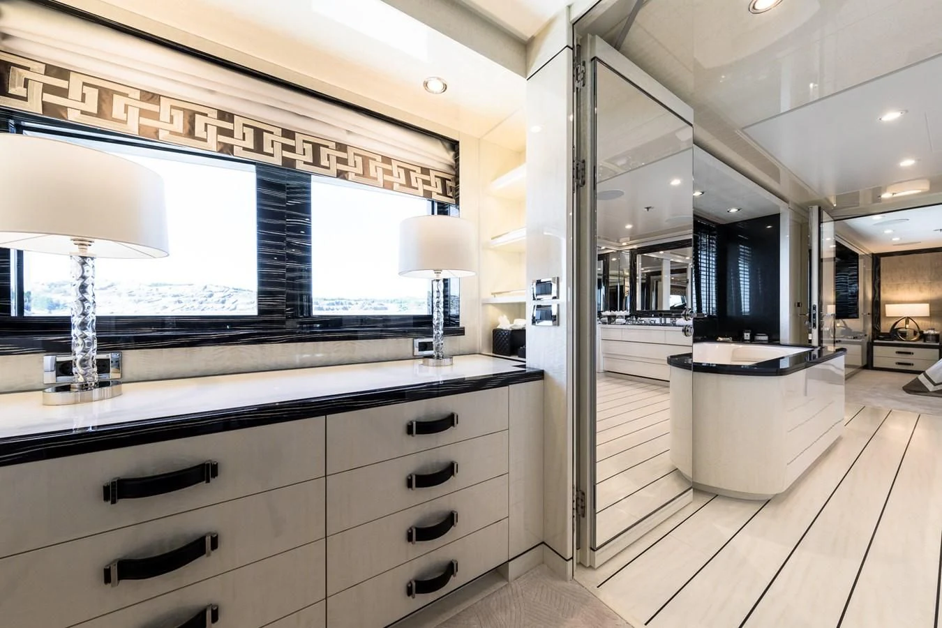 a kitchen with a large window aboard AMIGOS Yacht for Charter