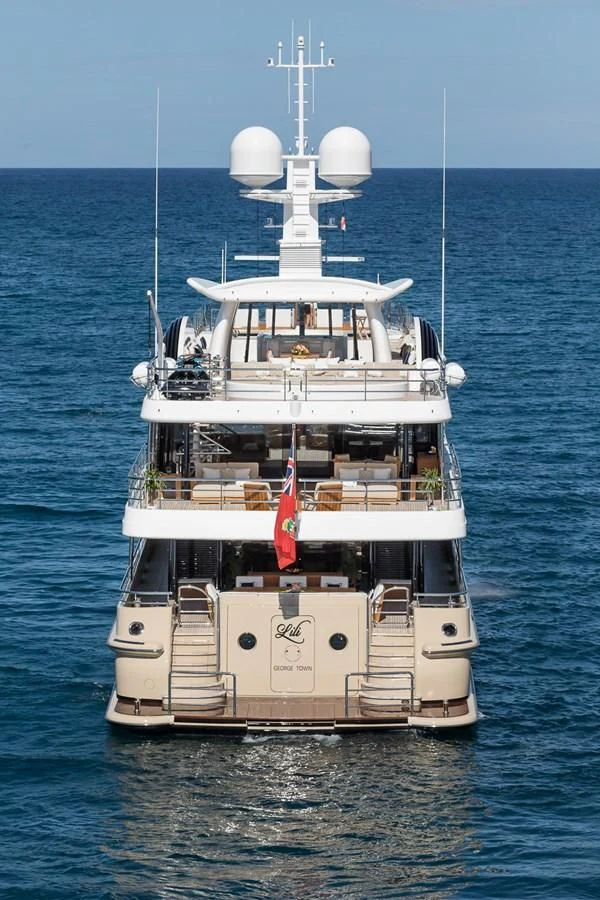 a large white boat in the water aboard AMIGOS Yacht for Charter