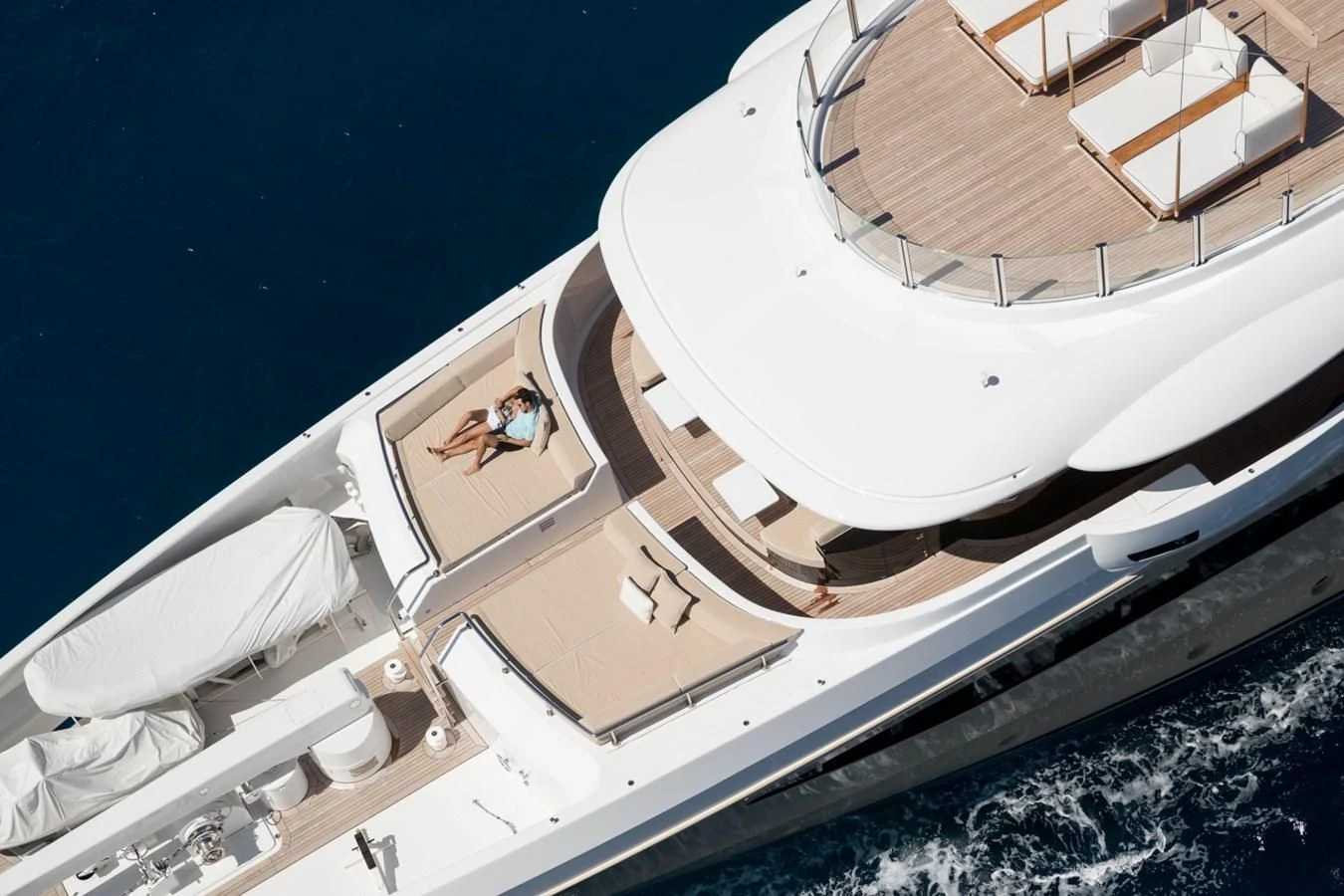 a person sitting on a boat aboard AMIGOS Yacht for Charter