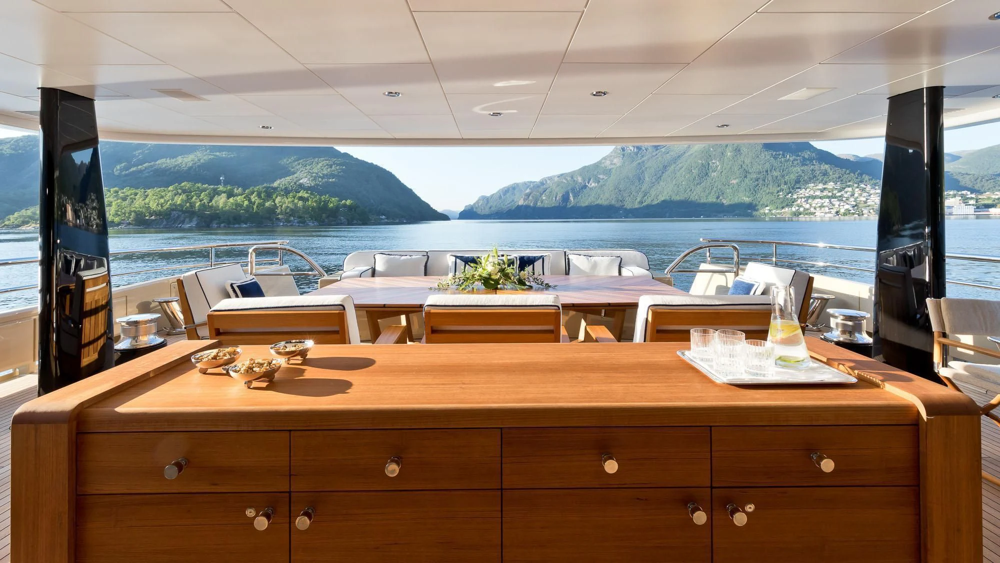 a counter top with a view of a mountain range aboard AMIGOS Yacht for Charter
