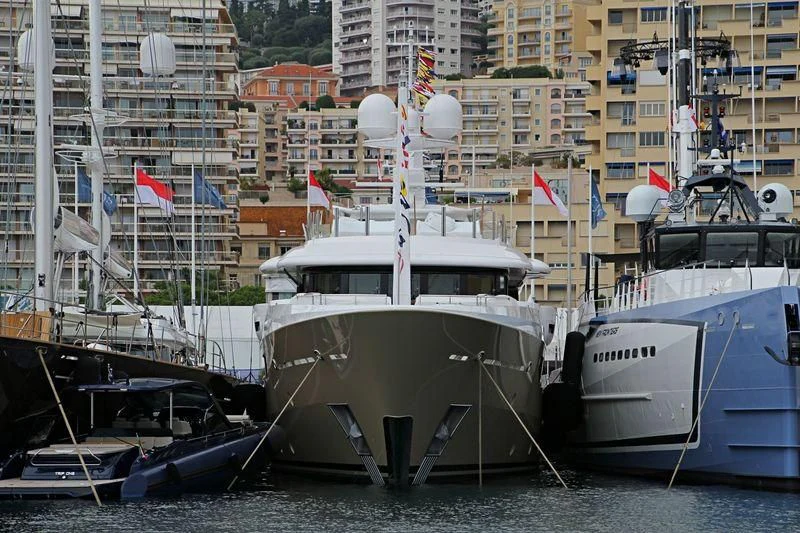 a boat docked at a pier aboard AMIGOS Yacht for Charter