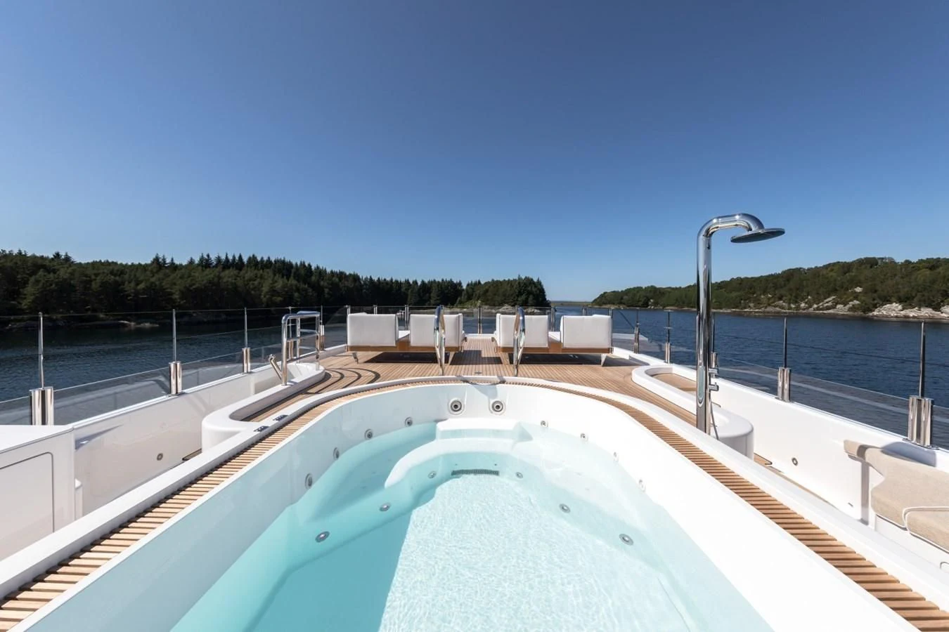 a swimming pool with a water slide aboard AMIGOS Yacht for Charter