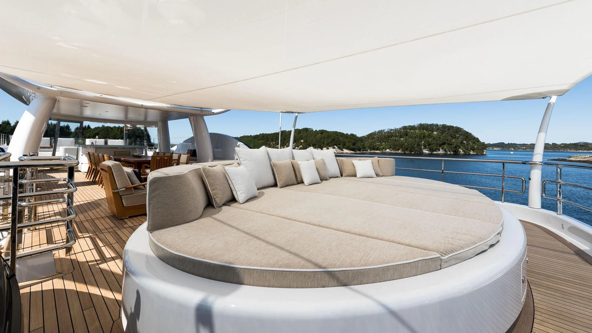 a large bed on a deck aboard AMIGOS Yacht for Charter