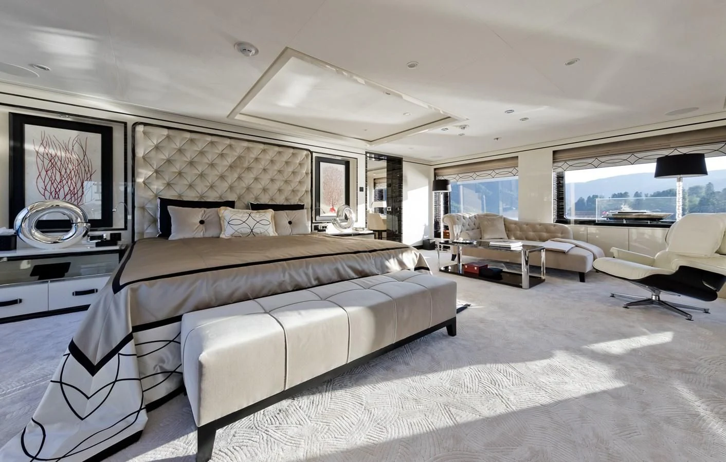 a large bedroom with a large bed aboard AMIGOS Yacht for Charter