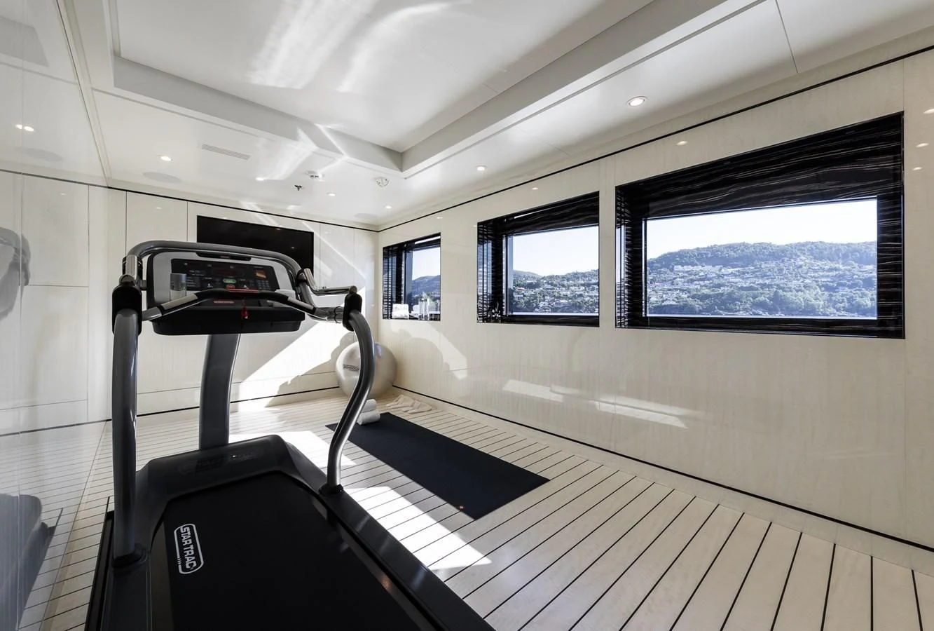 a treadmill in a room aboard AMIGOS Yacht for Charter