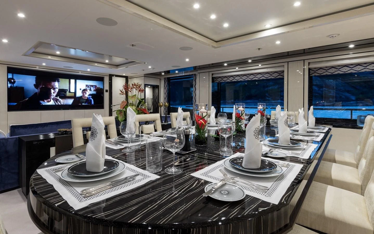 a table with a large screen aboard AMIGOS Yacht for Charter
