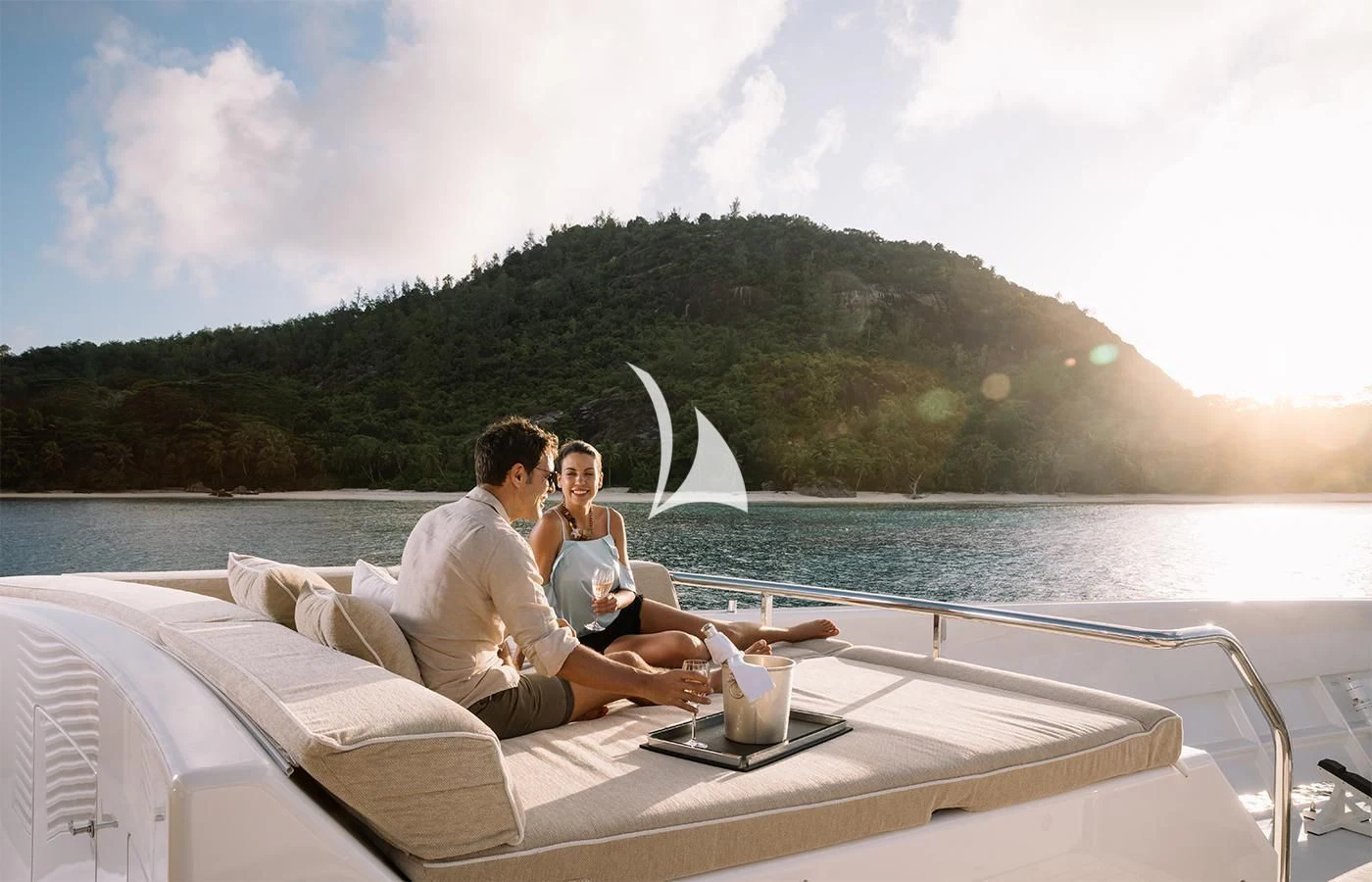 a man and woman sitting on a boat with a cup of coffee aboard AMIGOS Yacht for Charter